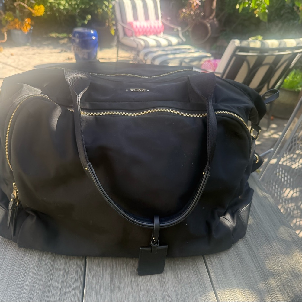 Tumi Black Weekender Travel Bag with Gold Accents